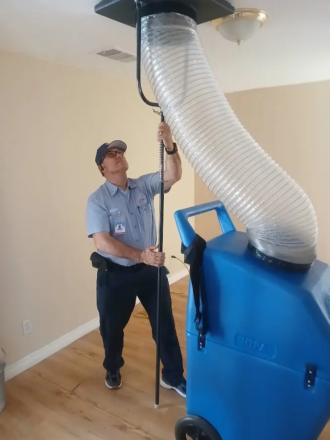 Furnace Tune-Up technician using HEPA equipment in Goodlettsville